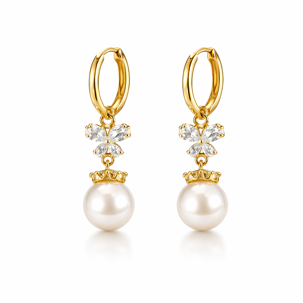 Gold hoop earrings with pearl and crystal drop pendants on a white background