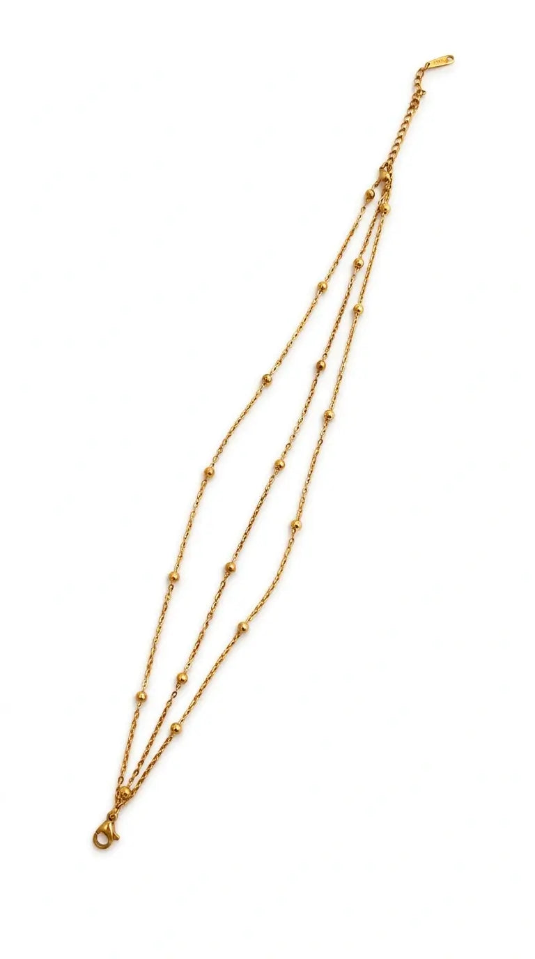 Gold necklace on a white background