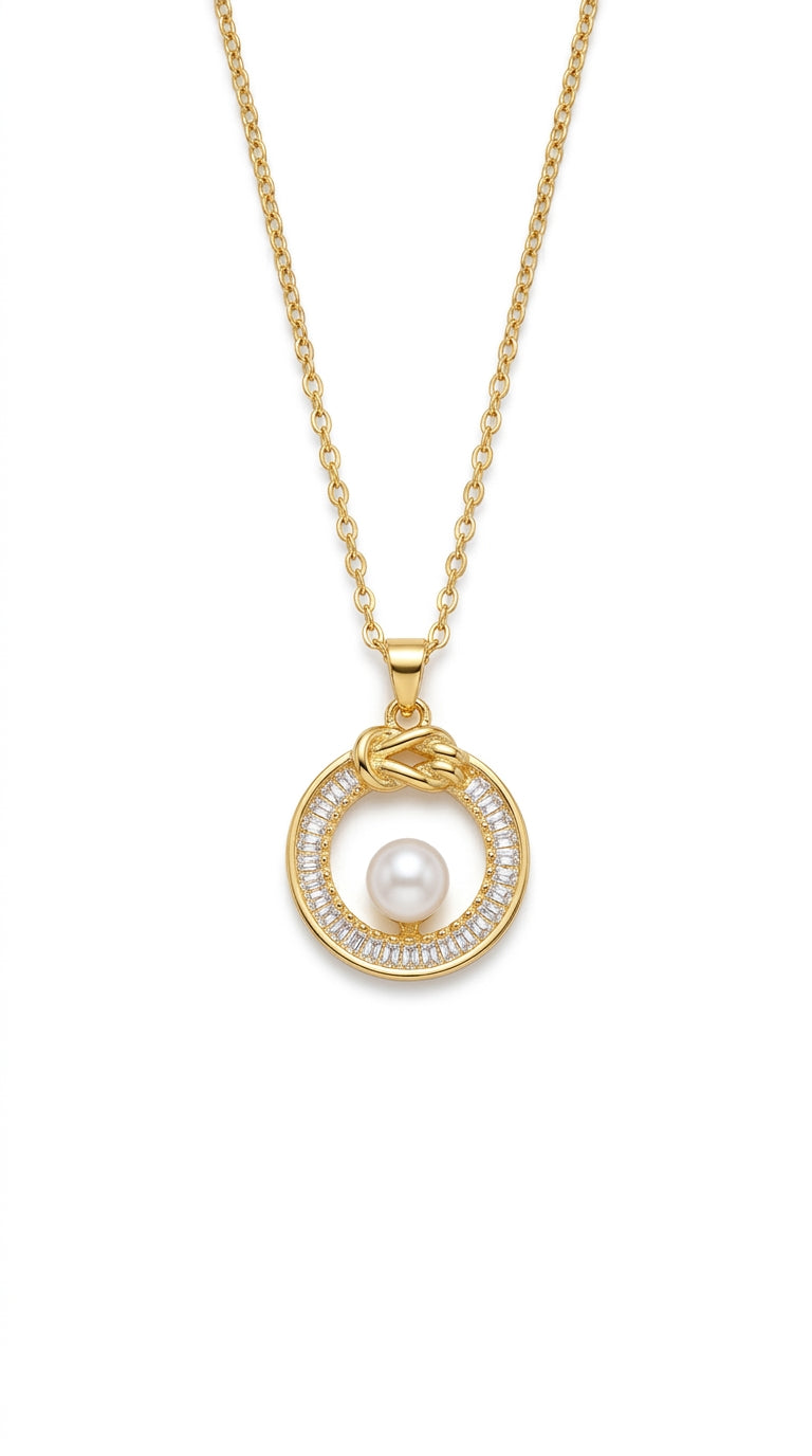 Gold necklace with a pearl pendant on a white background