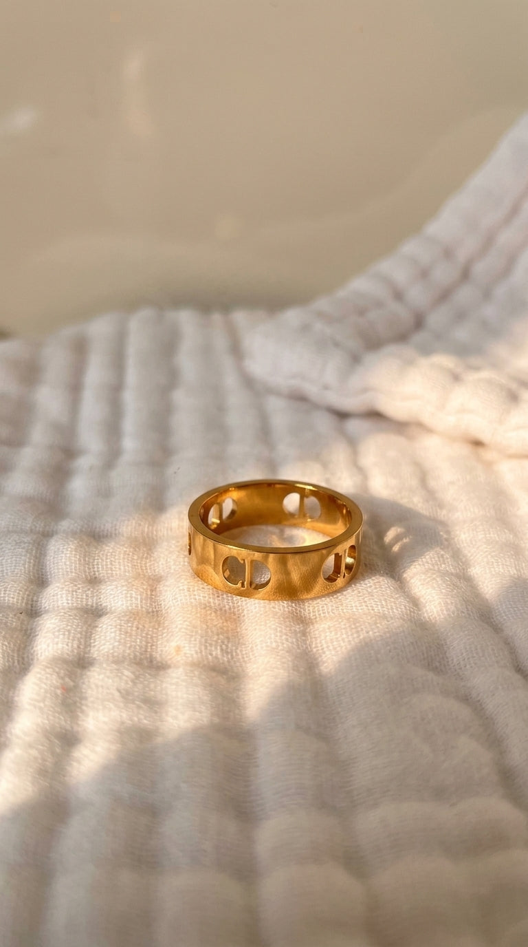 Gold ring on a textured white surface