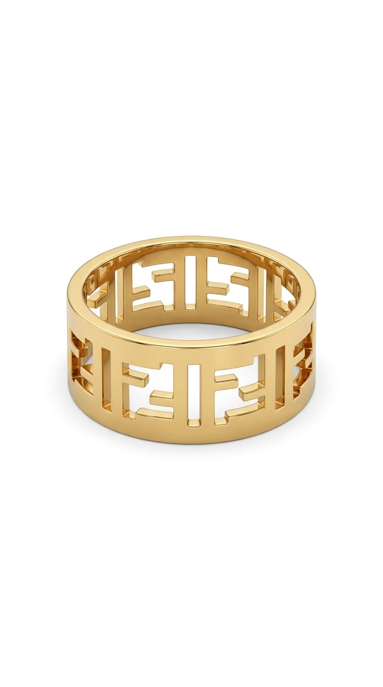 Gold ring with cut-out design on a white background