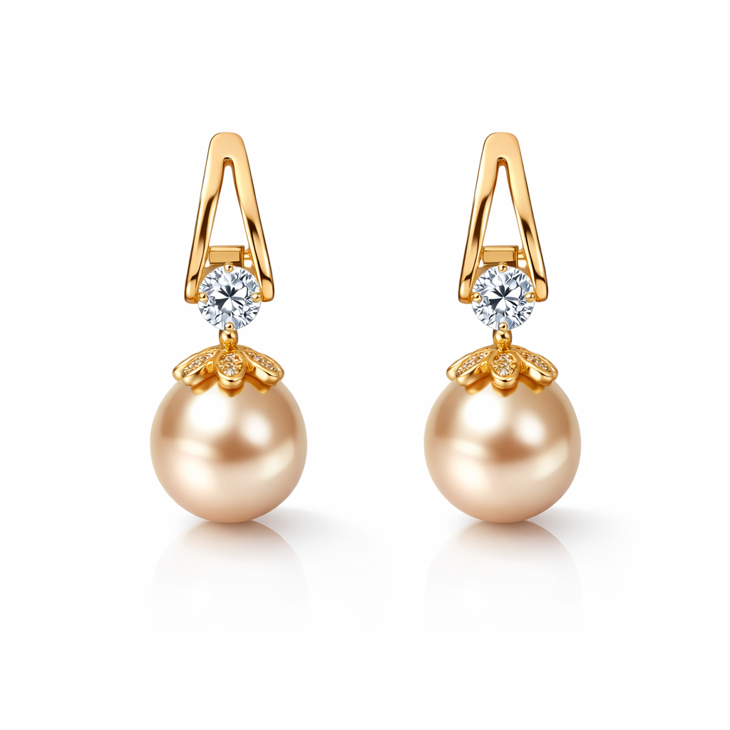 Pair of pearl earrings with gold accents and clear gemstones on a white background